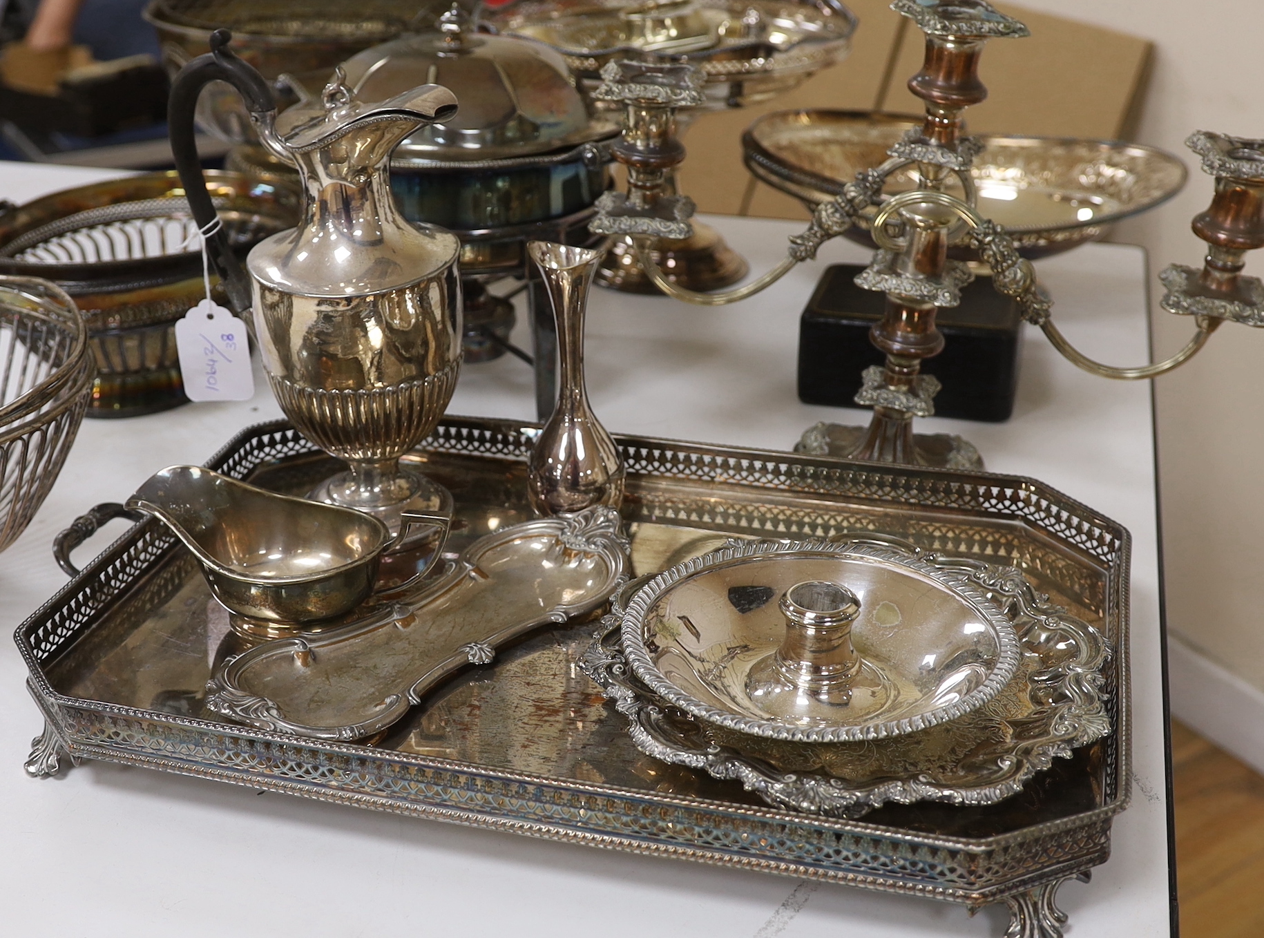 A quantity of mixed plate including a tray two baskets, candelabra , Tarzan etc